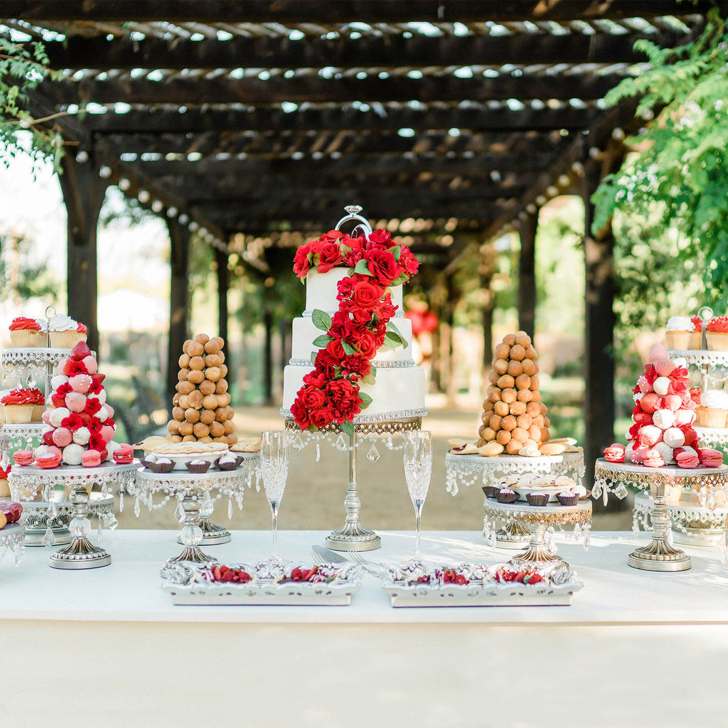 chandelier cake stands and dessert stands on wedding cake table