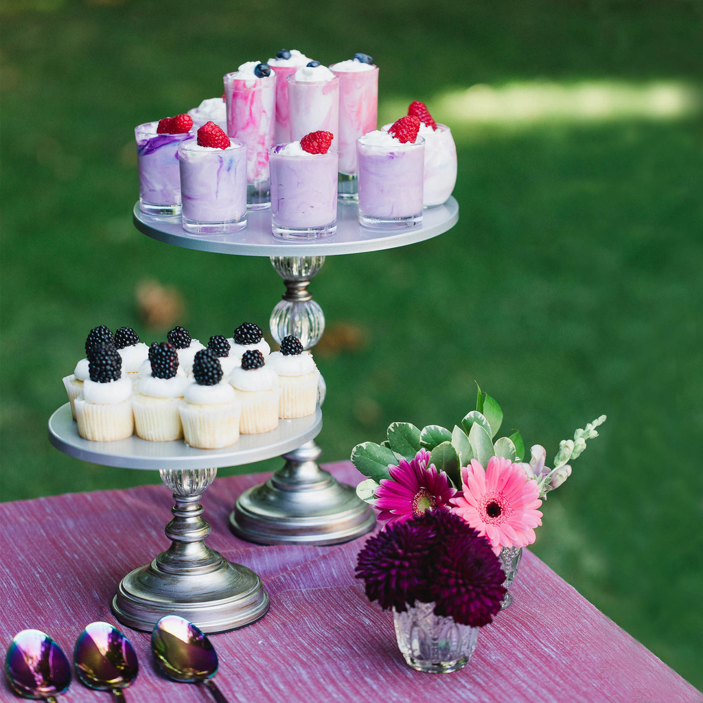 silver cake stands with mini desserts and cupcakes 