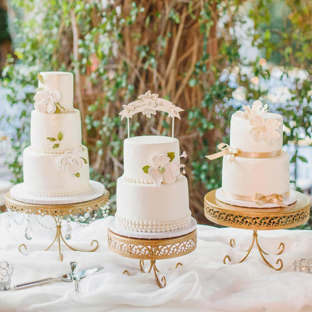 gold wedding cake stands with 3 wedding cakes