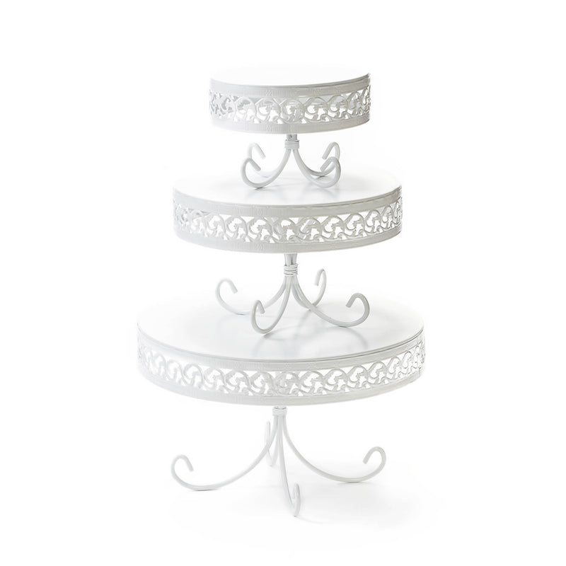 white round metal cake stand set with decorative border and loopy leg base